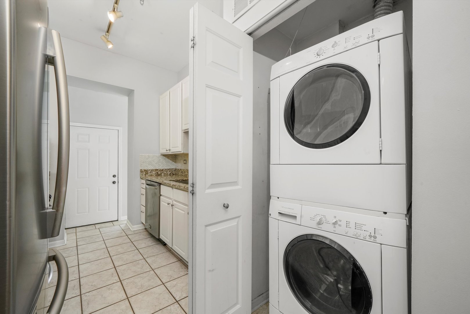 4536 North Sheridan Road, Unit 204 Chicago, IL 60640 - Photo 10 of 24 a view of a kitchen with washer and dryer