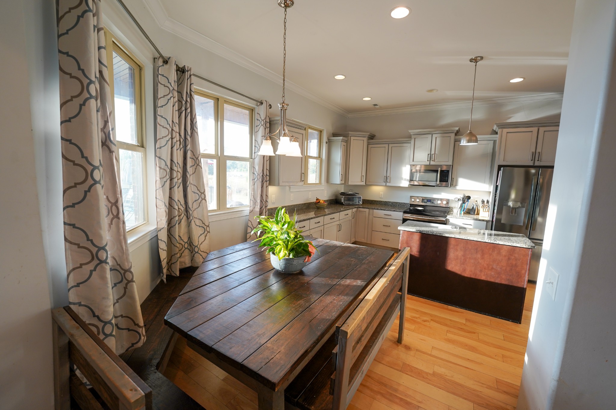 2172 Fellowship Road Mount Juliet, TN 37122 - Photo 26 of 53 a kitchen with a table chairs microwave and refrigerator