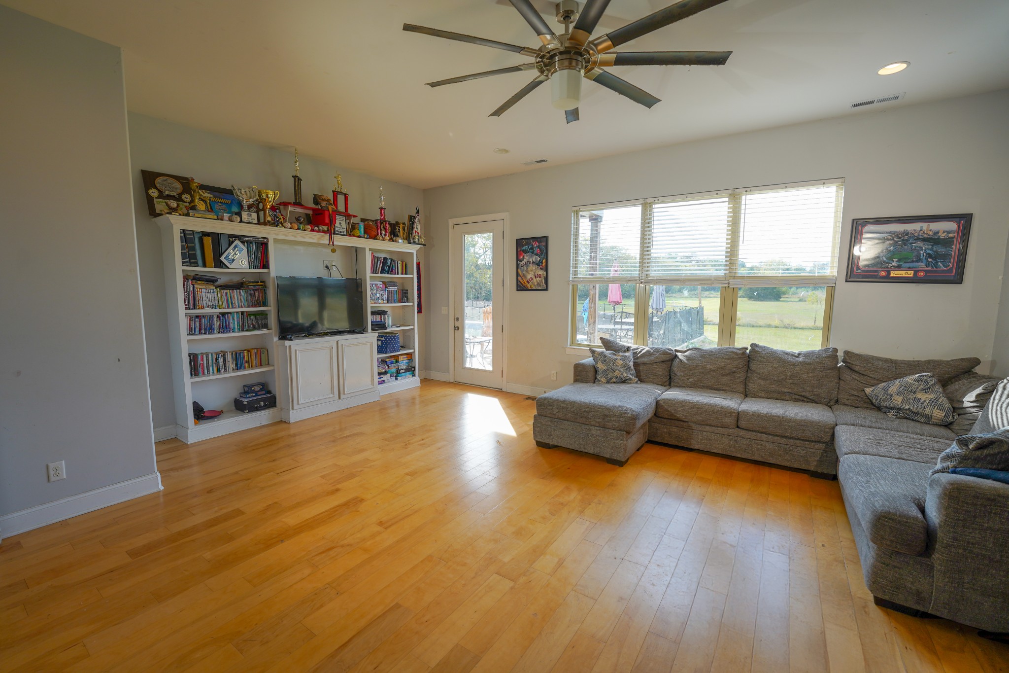 2172 Fellowship Road Mount Juliet, TN 37122 - Photo 30 of 53 a living room with furniture and a wooden floor