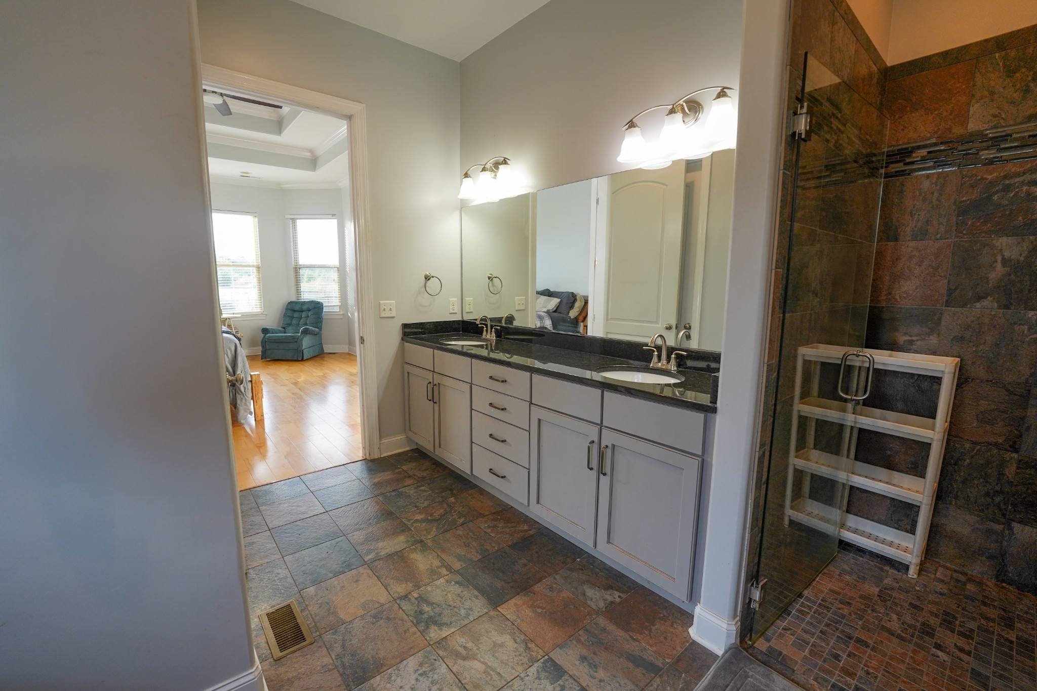 2172 Fellowship Road Mount Juliet, TN 37122 - Photo 35 of 53 a spacious bathroom with a granite countertop sink a mirror and a shower