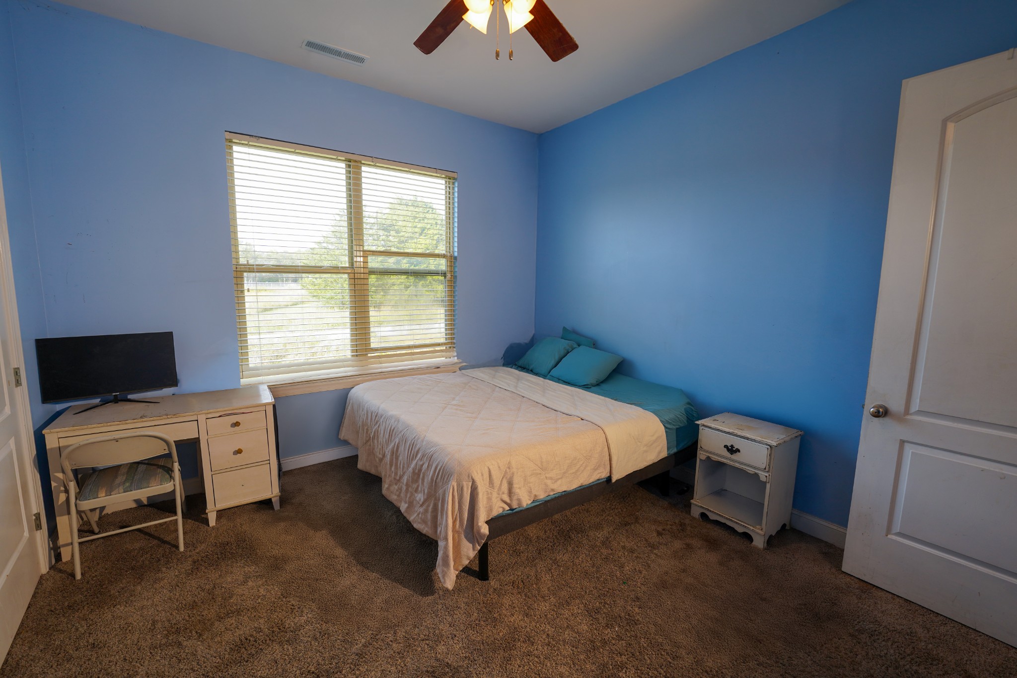 2172 Fellowship Road Mount Juliet, TN 37122 - Photo 44 of 53 a bedroom with a bed and a chandelier