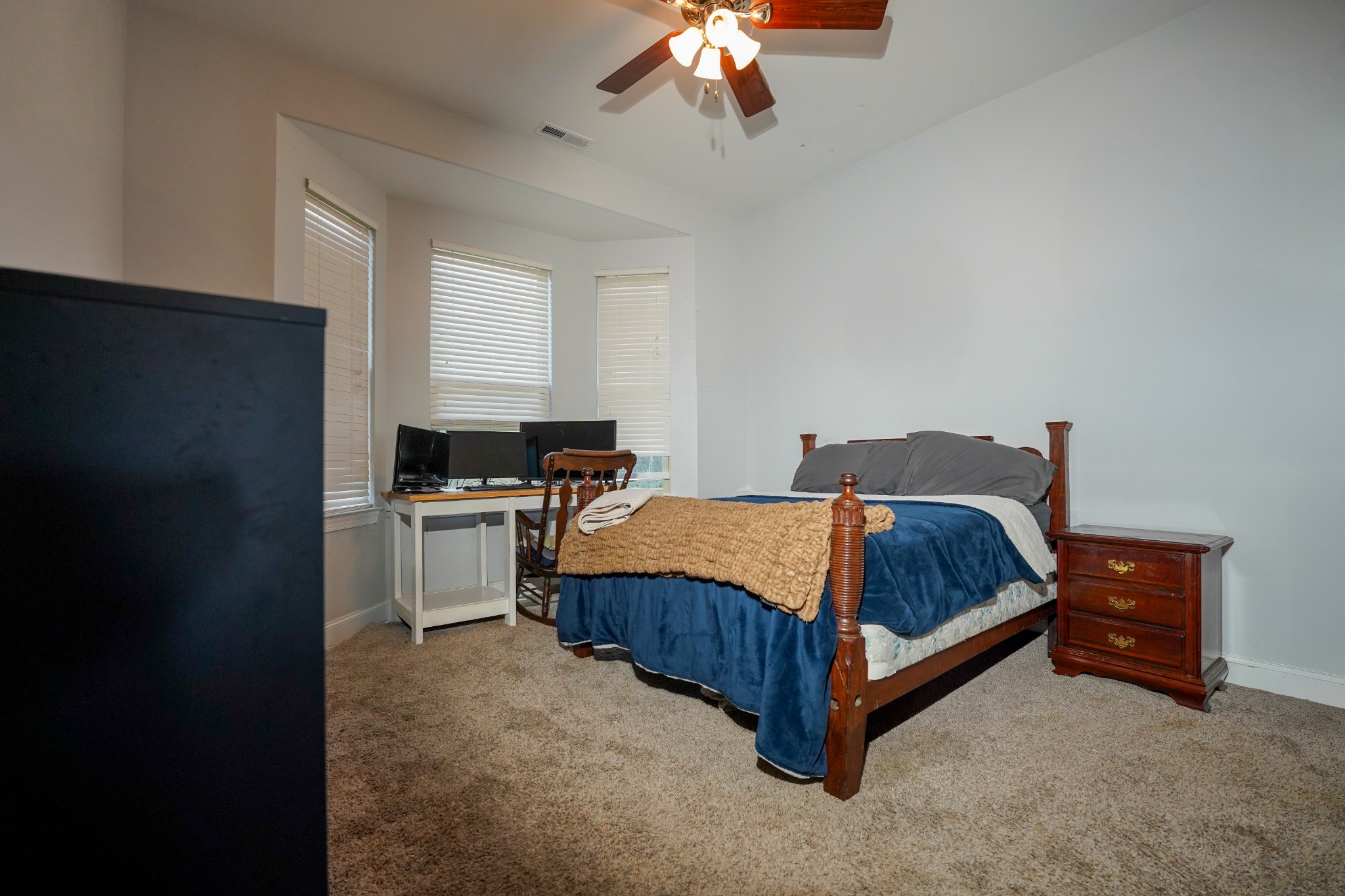 2172 Fellowship Road Mount Juliet, TN 37122 - Photo 47 of 53 a bedroom with a bed and a chandelier