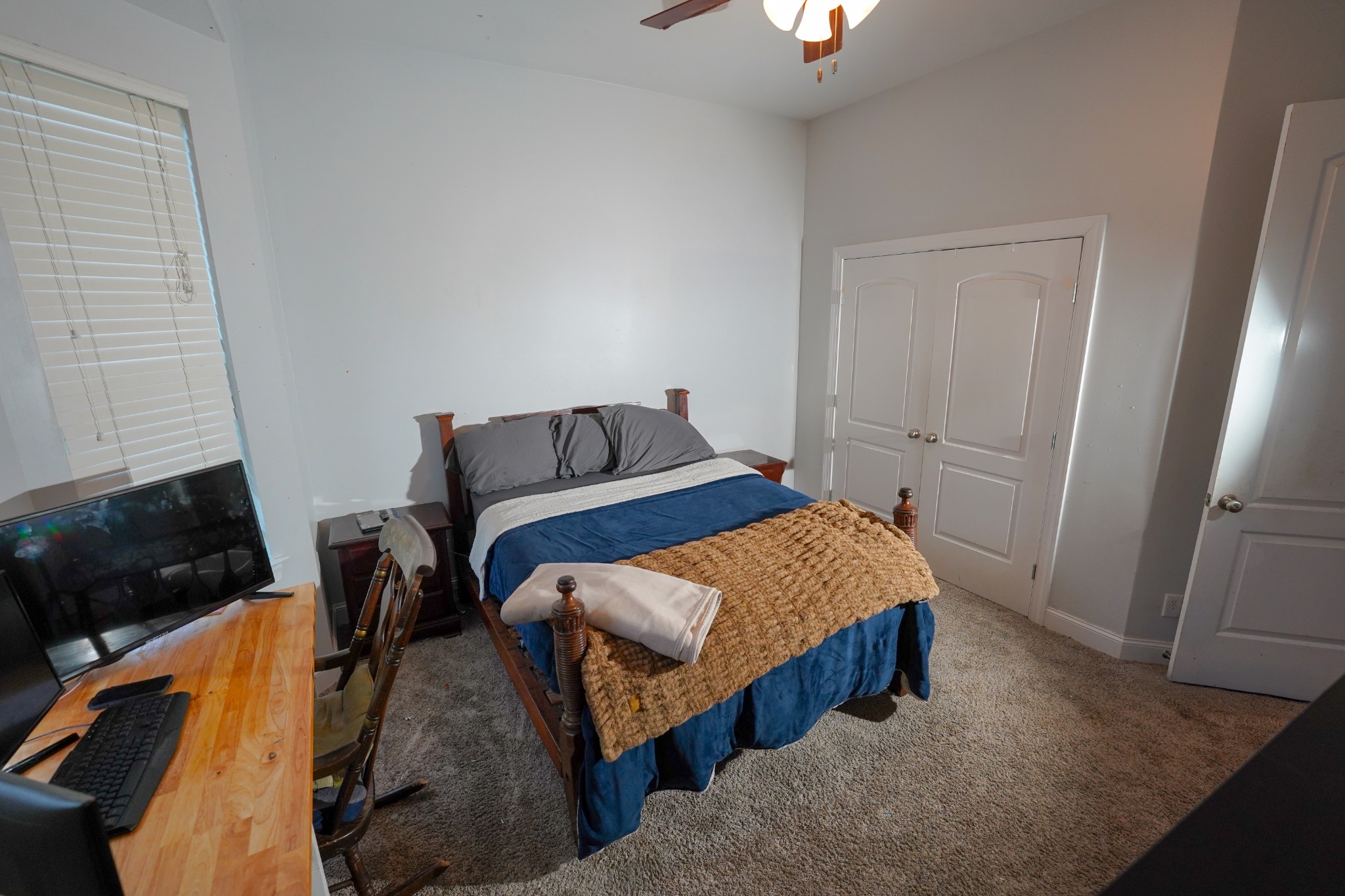 2172 Fellowship Road Mount Juliet, TN 37122 - Photo 48 of 53 a bedroom with a bed a couch and a flat tv screen on the dresser
