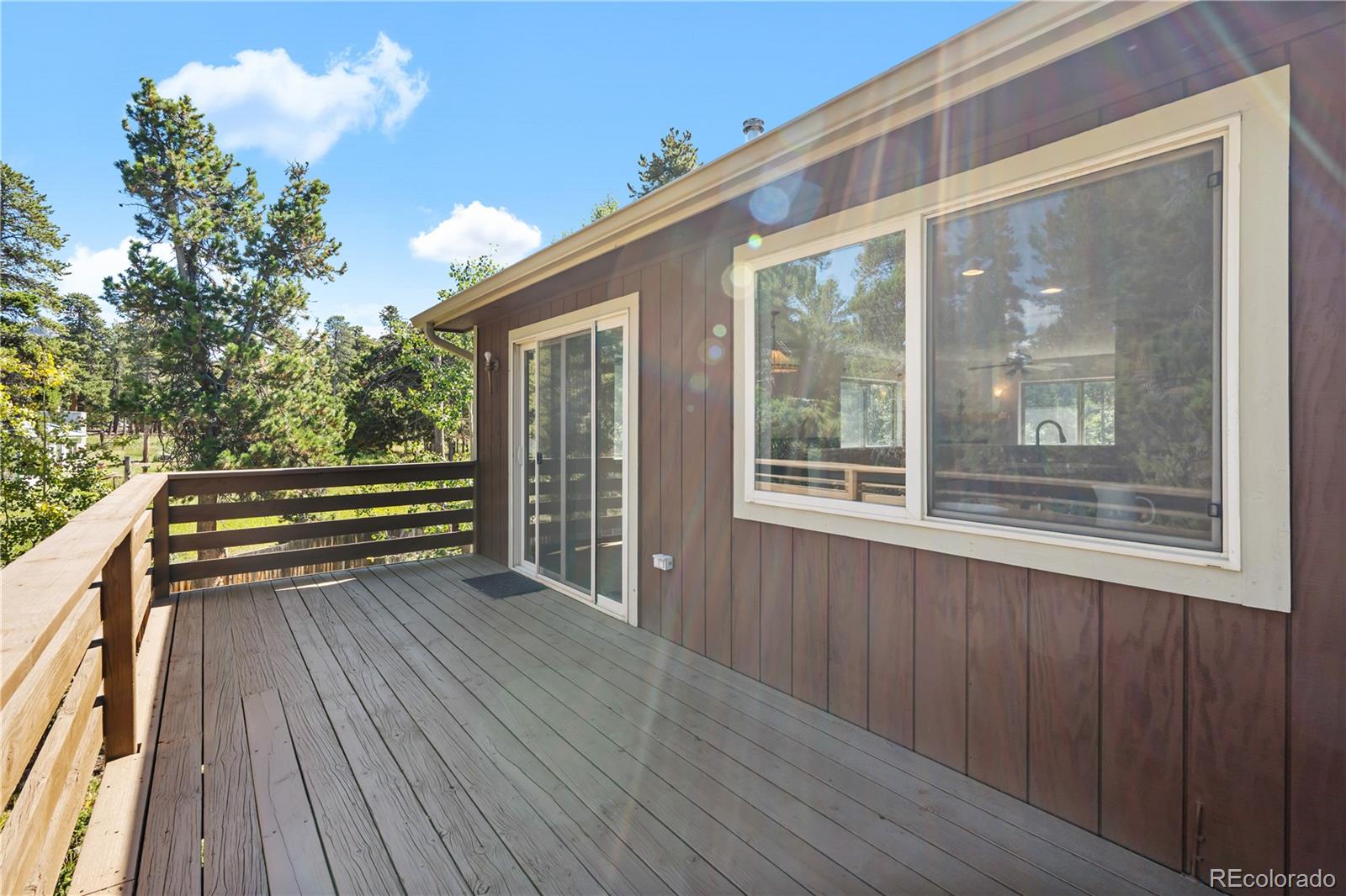 4 Gap Road Black Hawk, CO 80422 - Photo 16 of 43 a view of outdoor space with deck and wooden floor