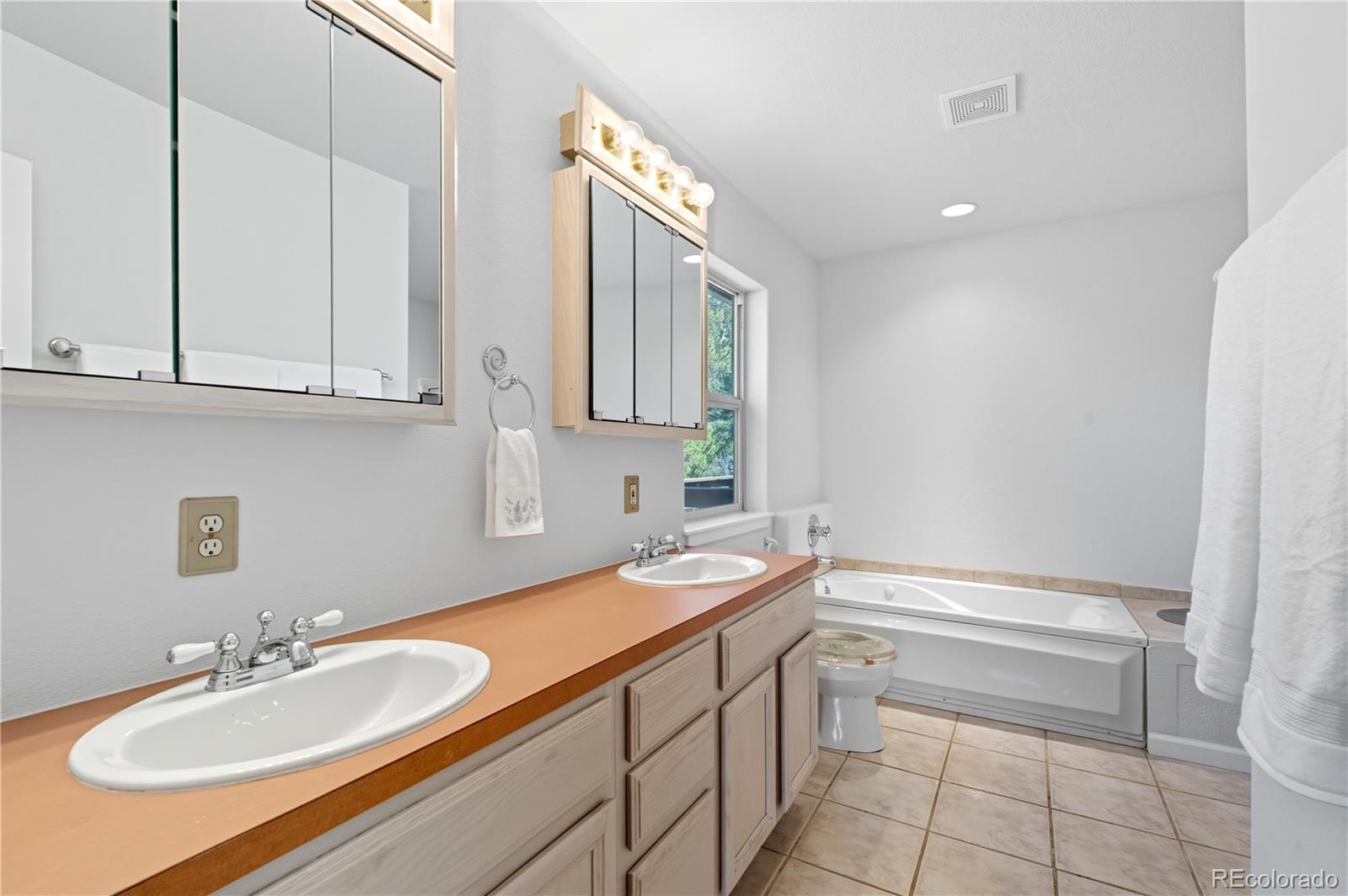 4 Gap Road Black Hawk, CO 80422 - Photo 23 of 43 a bathroom with a sink and a mirror
