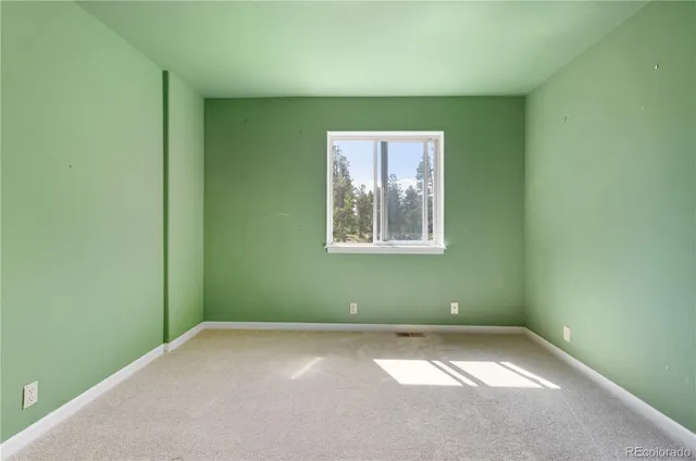 a bathroom with a sink toilet and a mirror