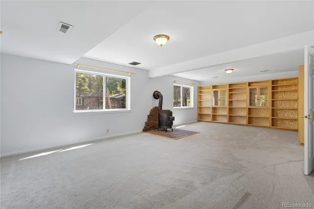 a view of a livingroom with a chair and a window