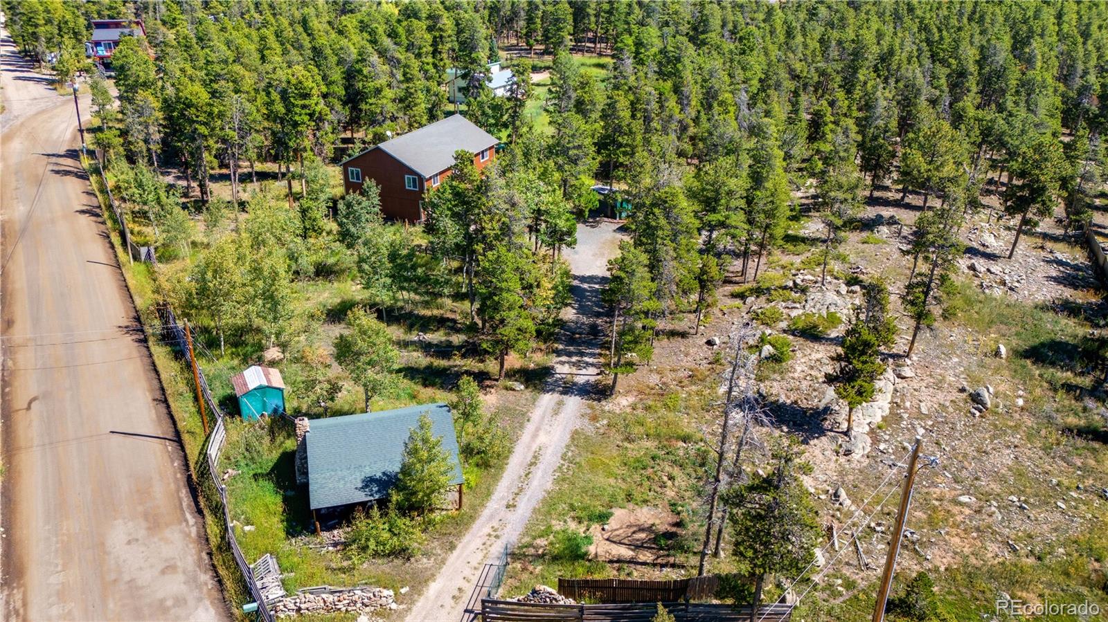 4 Gap Road Black Hawk, CO 80422 - Photo 42 of 43 an aerial view of a house with a yard and garden
