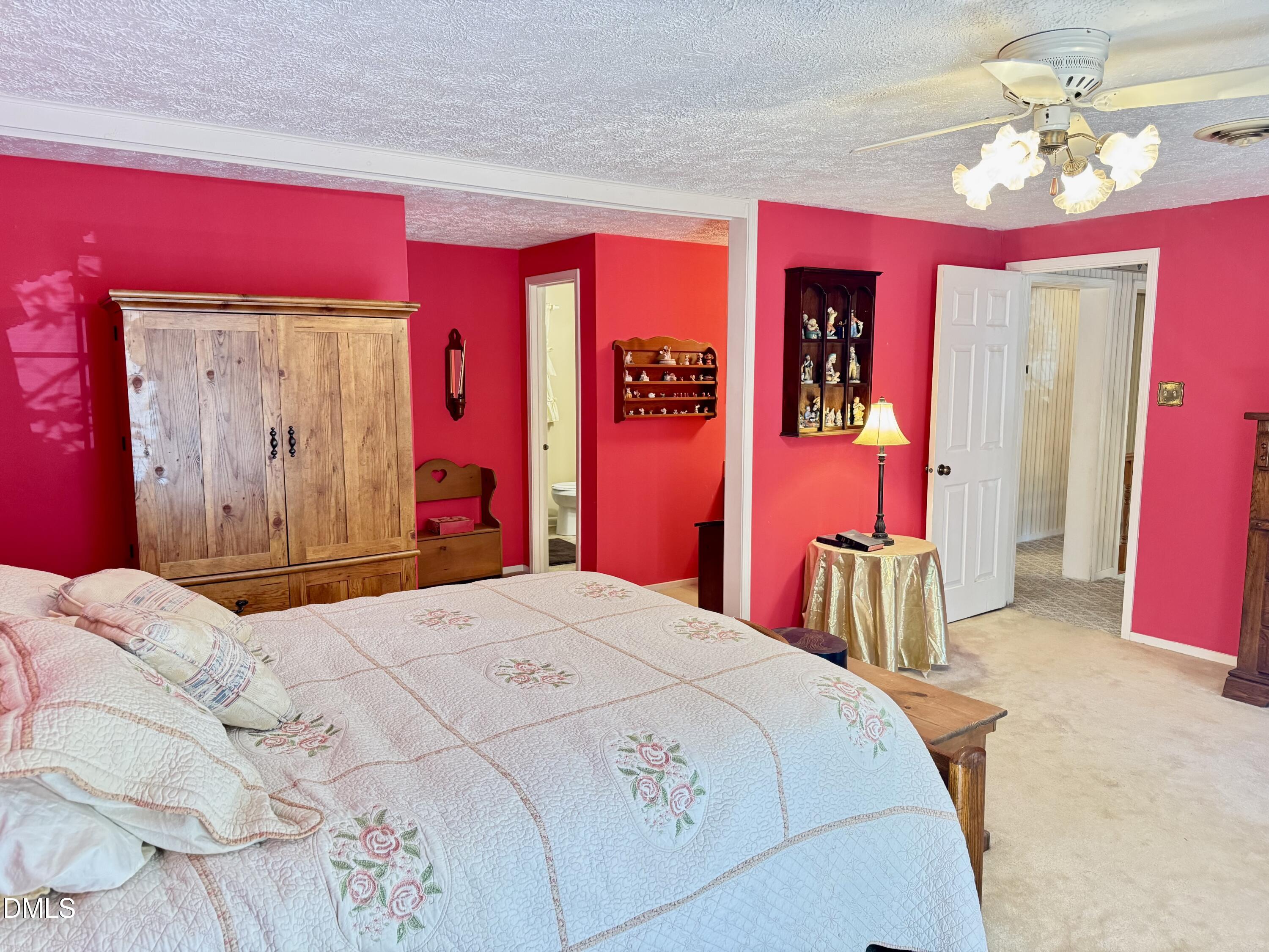 84 Wintergreen Road Henderson, NC 27537 - Photo 22 of 49 a bedroom with a bed and a mirror