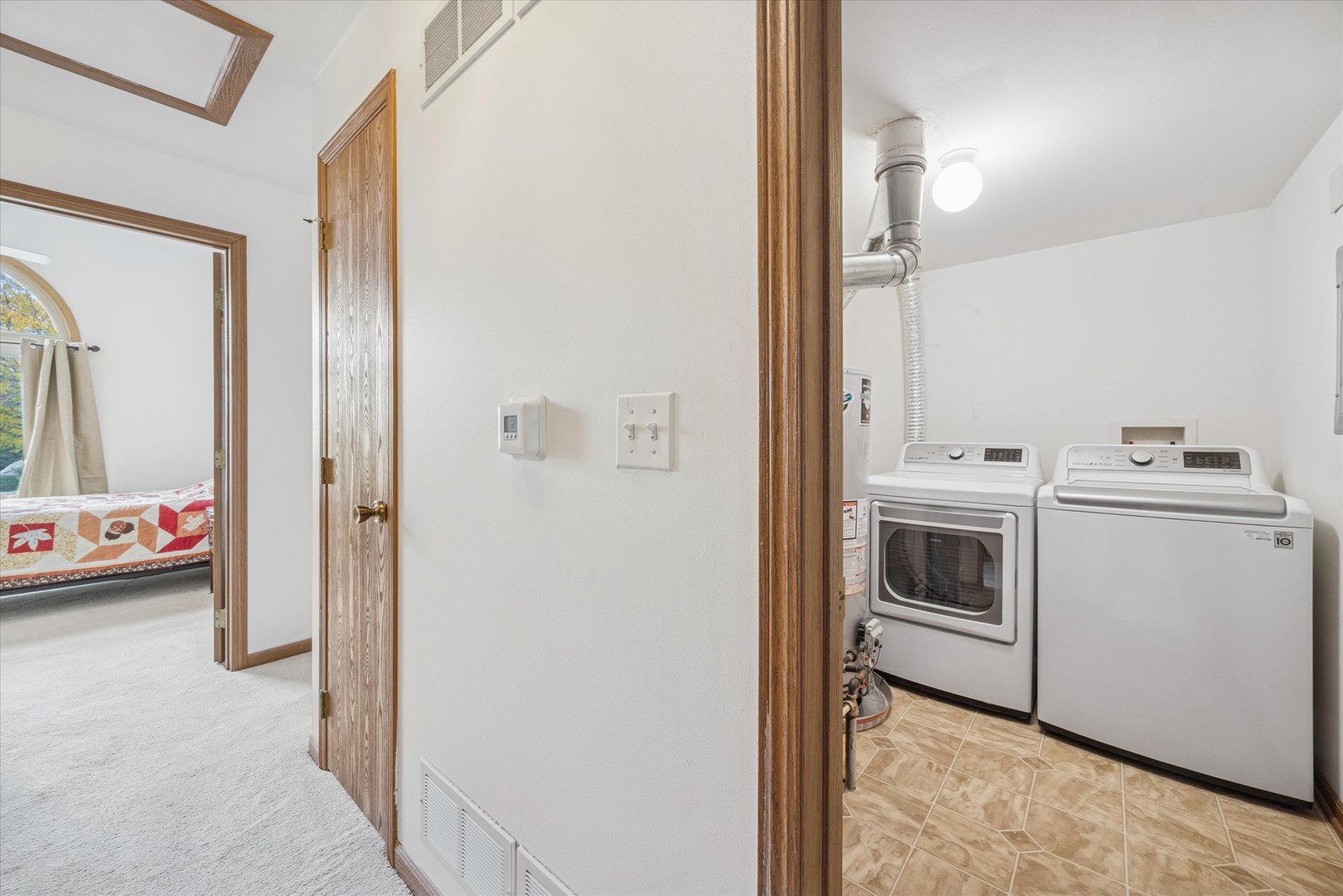 2689 Jodee Drive, Unit B Joliet, IL 60436 - Photo 13 of 16 a view of storage and utility room with washer and dryer