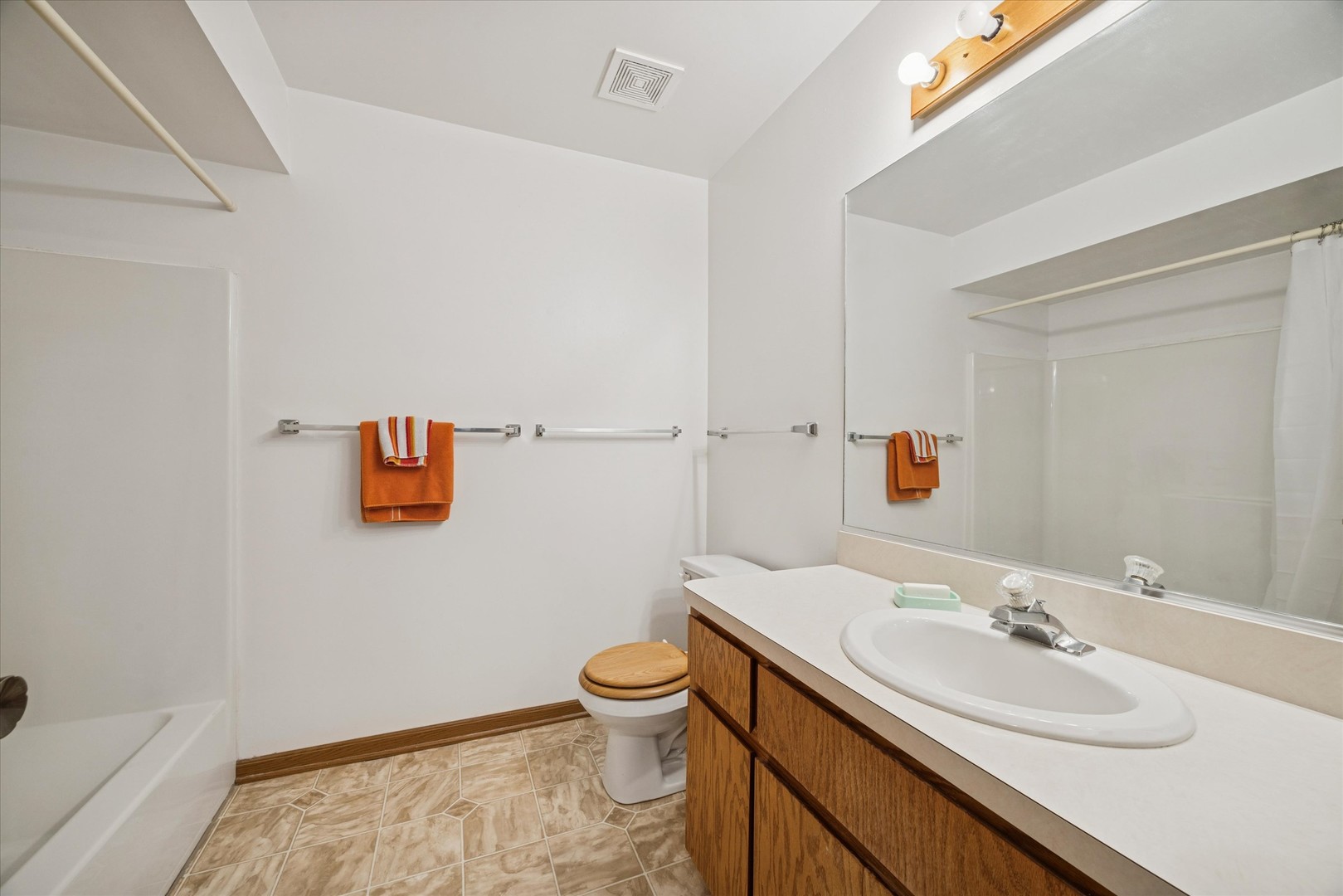 2689 Jodee Drive, Unit B Joliet, IL 60436 - Photo 14 of 16 a bathroom with a sink and a toilet