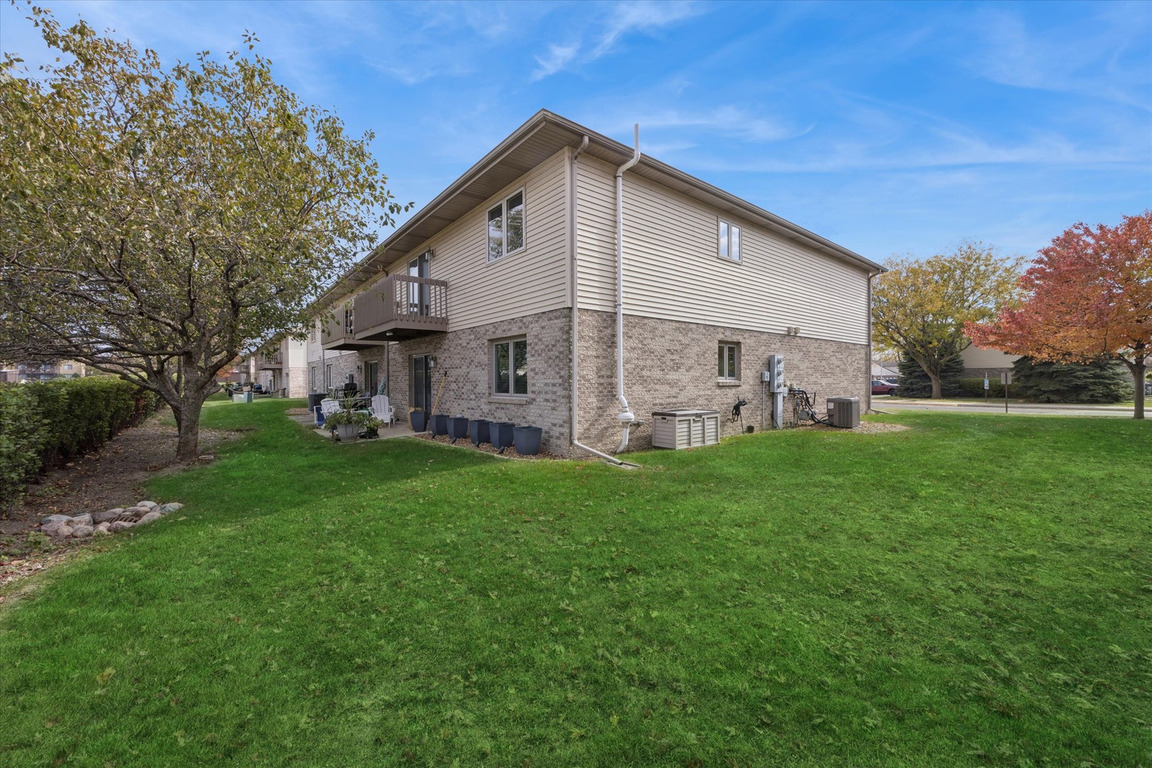 2689 Jodee Drive, Unit B Joliet, IL 60436 - Photo 15 of 16 a front view of house with yard and green space
