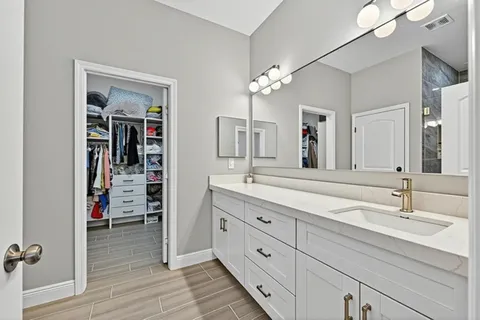 a large kitchen with a table and chairs