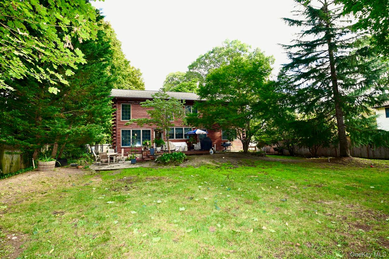 216 5th Street St. James, NY 11780 - Photo 21 of 21 Back of house featuring log exterior and a deck