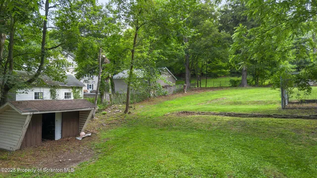 a view of a backyard with a garden