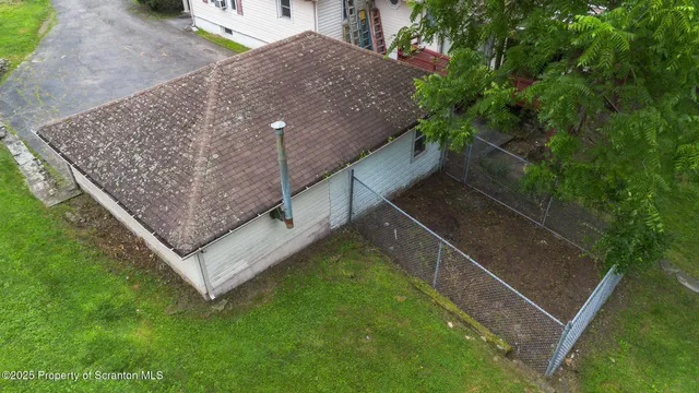 a view of a patio with a table chairs and a table