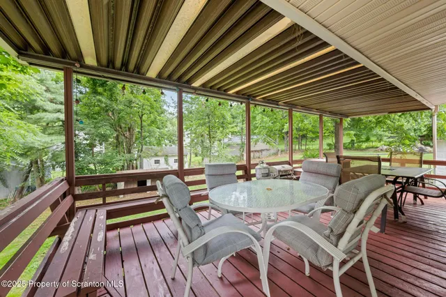 a living room with furniture window and a flat screen tv