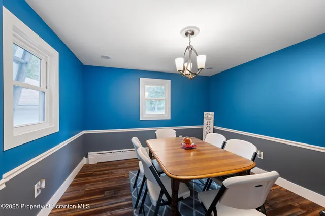 a kitchen with granite countertop a stove top oven and cabinets