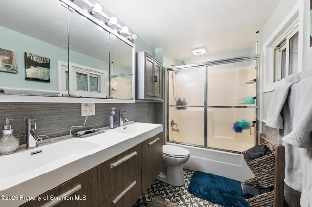 a living room with a flat screen tv and gym equipment