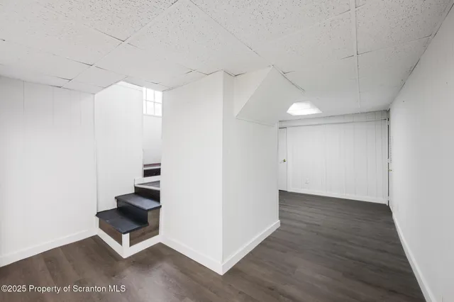 a storage room with water heater and racks