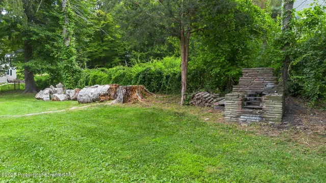 a backyard of a house with lots of green space