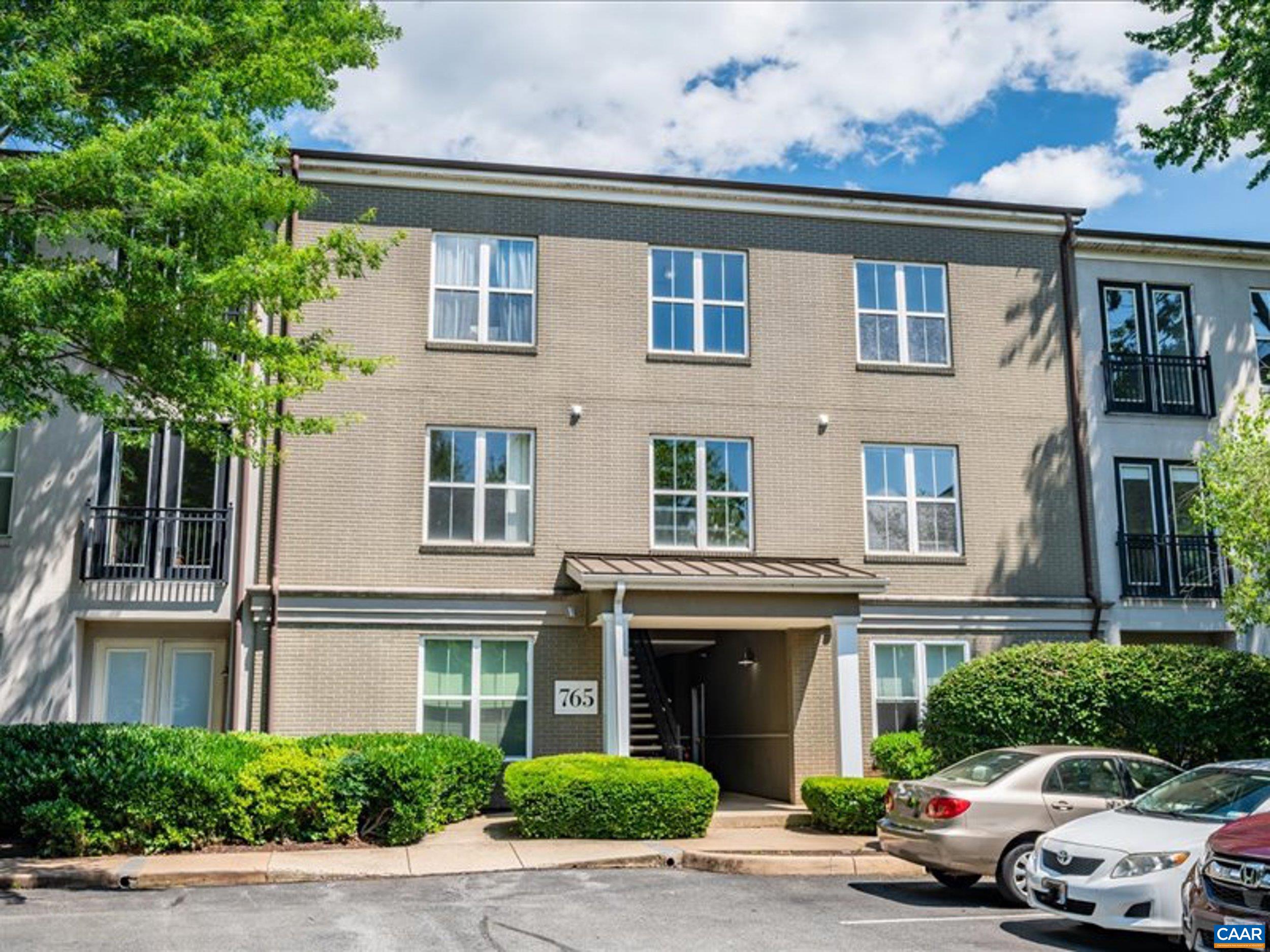 765 Walker Square, Unit 2D Charlottesville, VA 22903 - Photo 1 of 33 a view of a car parked in front of a building
