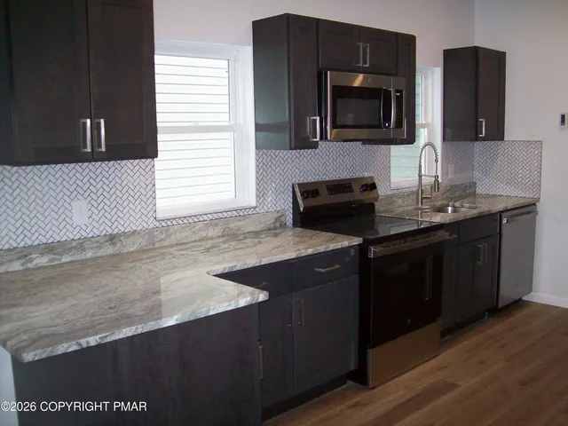 a kitchen with a sink and a microwave