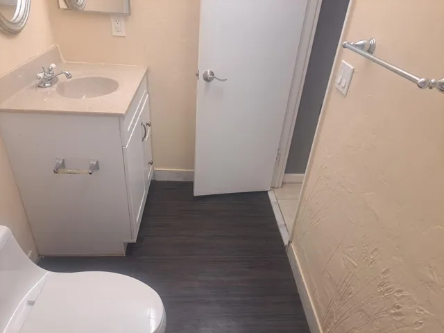 a kitchen with a refrigerator and cabinets