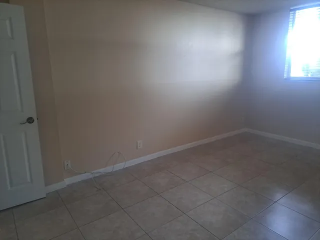 a bathroom with a toilet and a bathtub