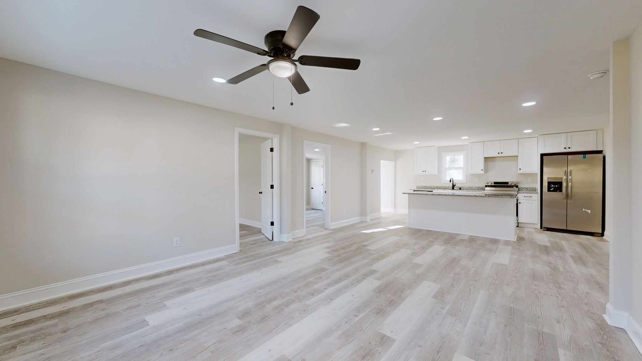 109 Wells Street Centerville, TN 37033 - Photo 5 of 19 a view of an empty room and kitchen view