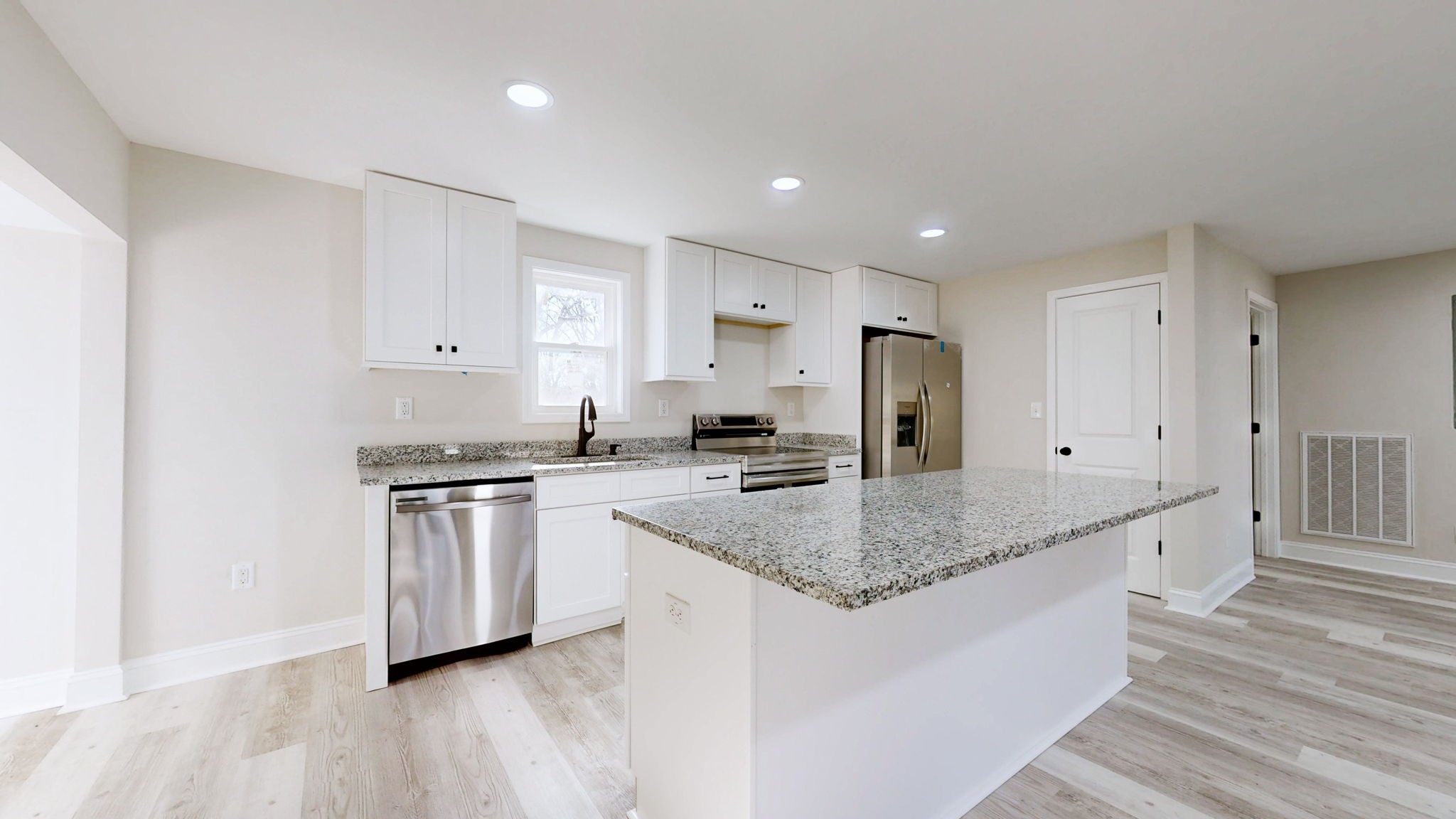 109 Wells Street Centerville, TN 37033 - Photo 8 of 19 a kitchen with stainless steel appliances granite countertop a sink stove and cabinets