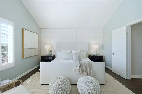 a spacious bathroom with a granite countertop sink a mirror and a shower