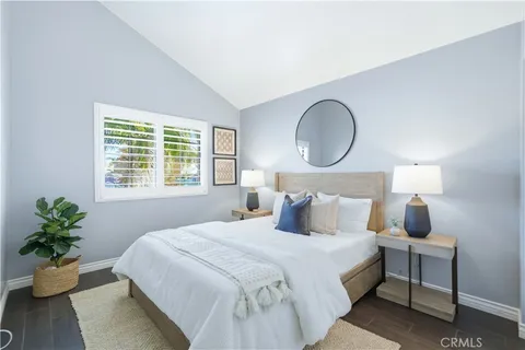 a bedroom with a large bed and a window