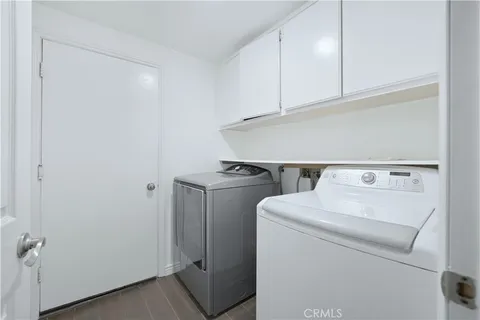 a view of a patio with table and chairs and potted plants