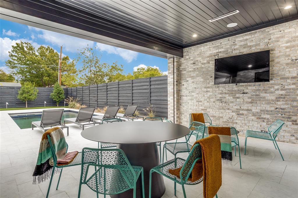 7610 Linwood Avenue Dallas, TX 75209 - Photo 25 of 25 a view of a patio with a dining table and chairs