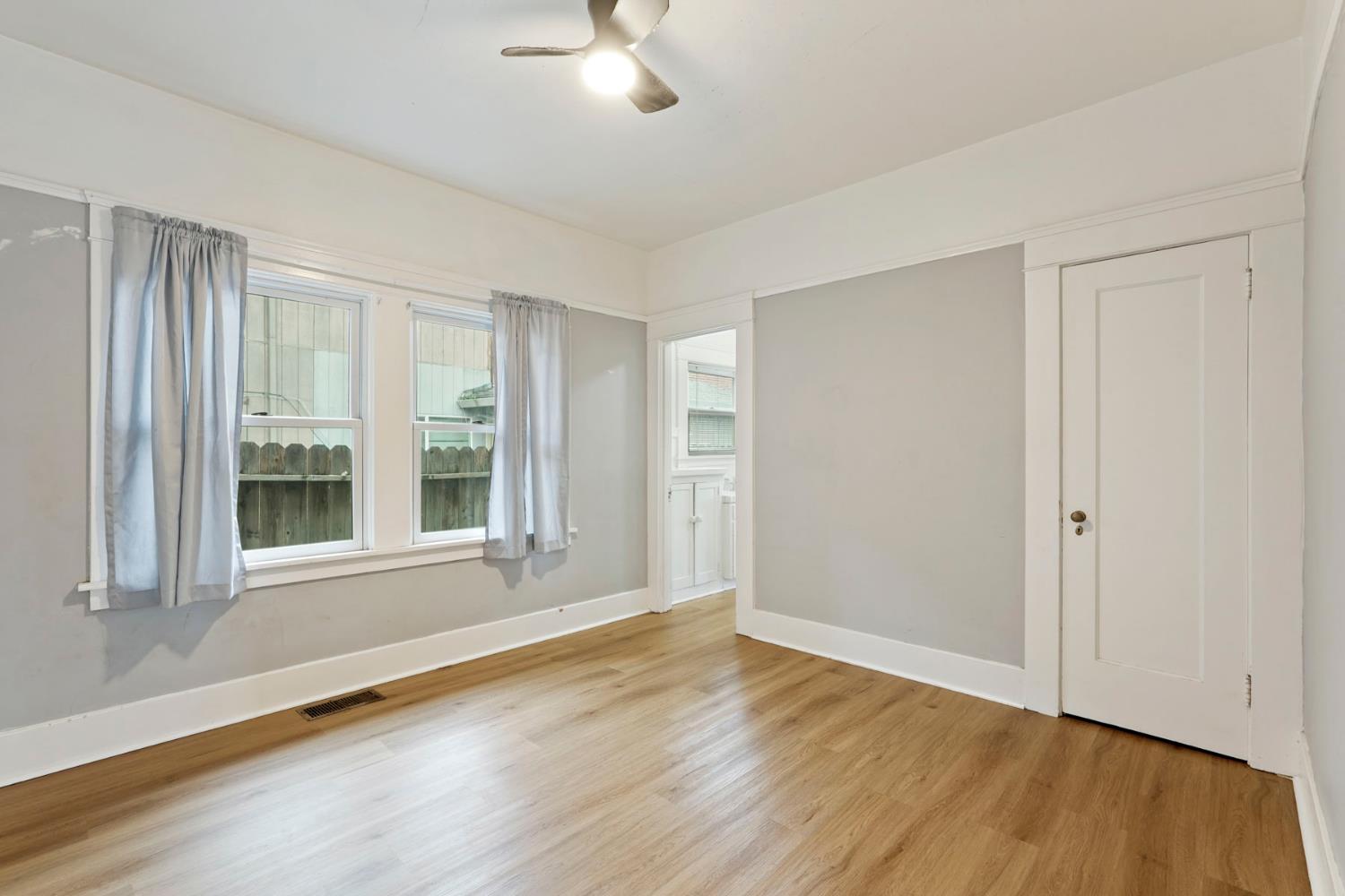 400 Chestnut Street Lodi, CA 95240 - Photo 19 of 36 a view of an empty room with wooden floor and a window