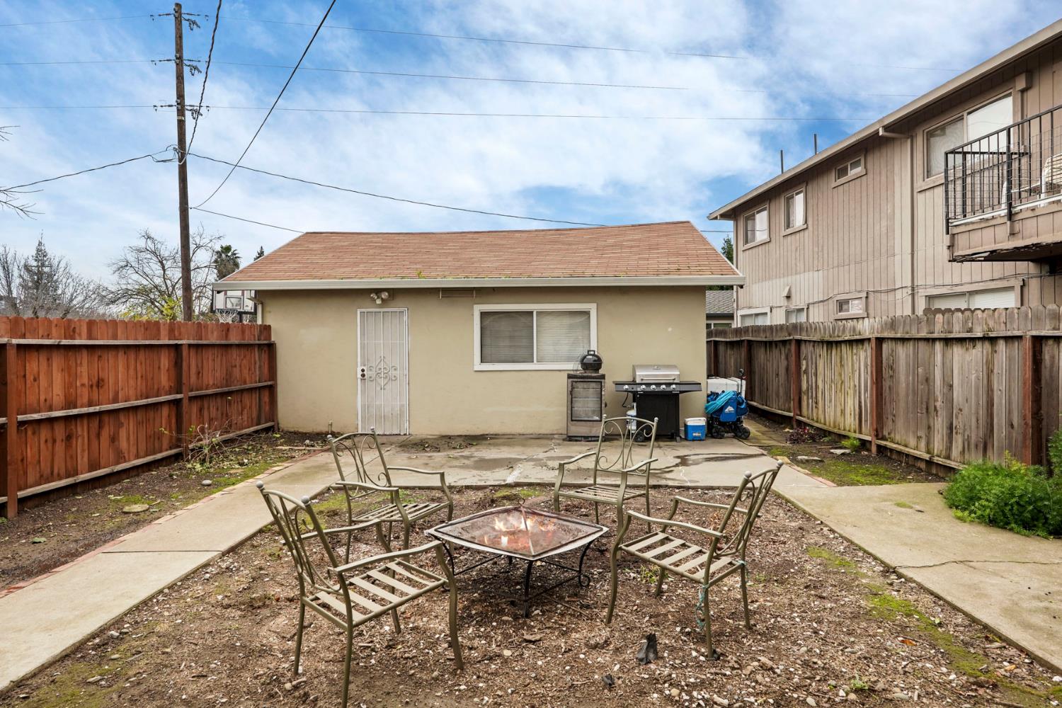 400 Chestnut Street Lodi, CA 95240 - Photo 34 of 36 a backyard of a house with yard and outdoor seating