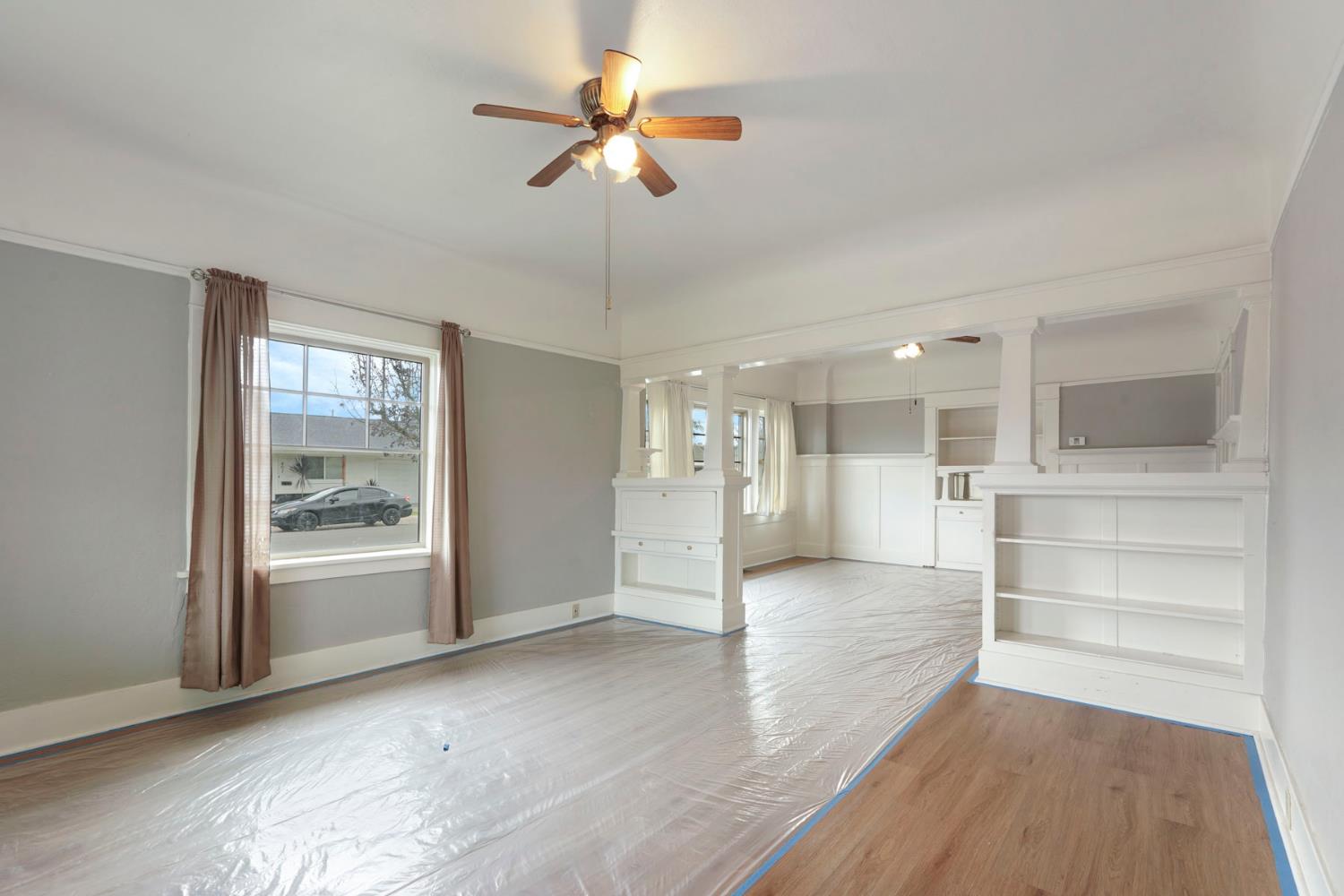 400 Chestnut Street Lodi, CA 95240 - Photo 10 of 36 a view of an empty room with a window and wooden floor