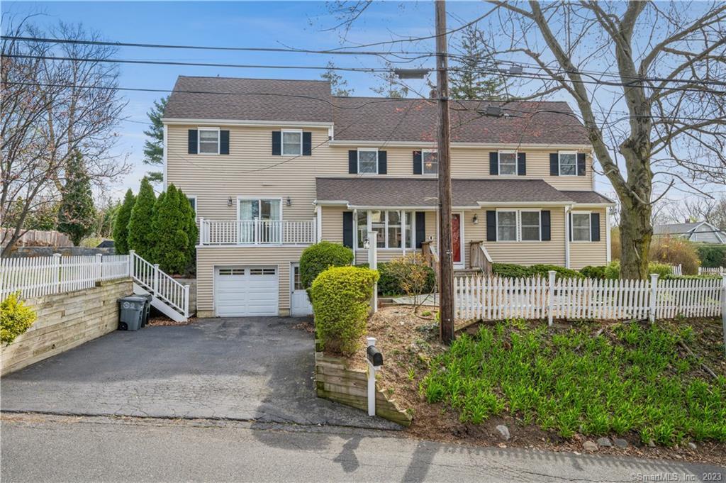 25 Ridgeley Street Darien, CT 06820 - Photo 1 of 1 a view of a house with a backyard and a tree
