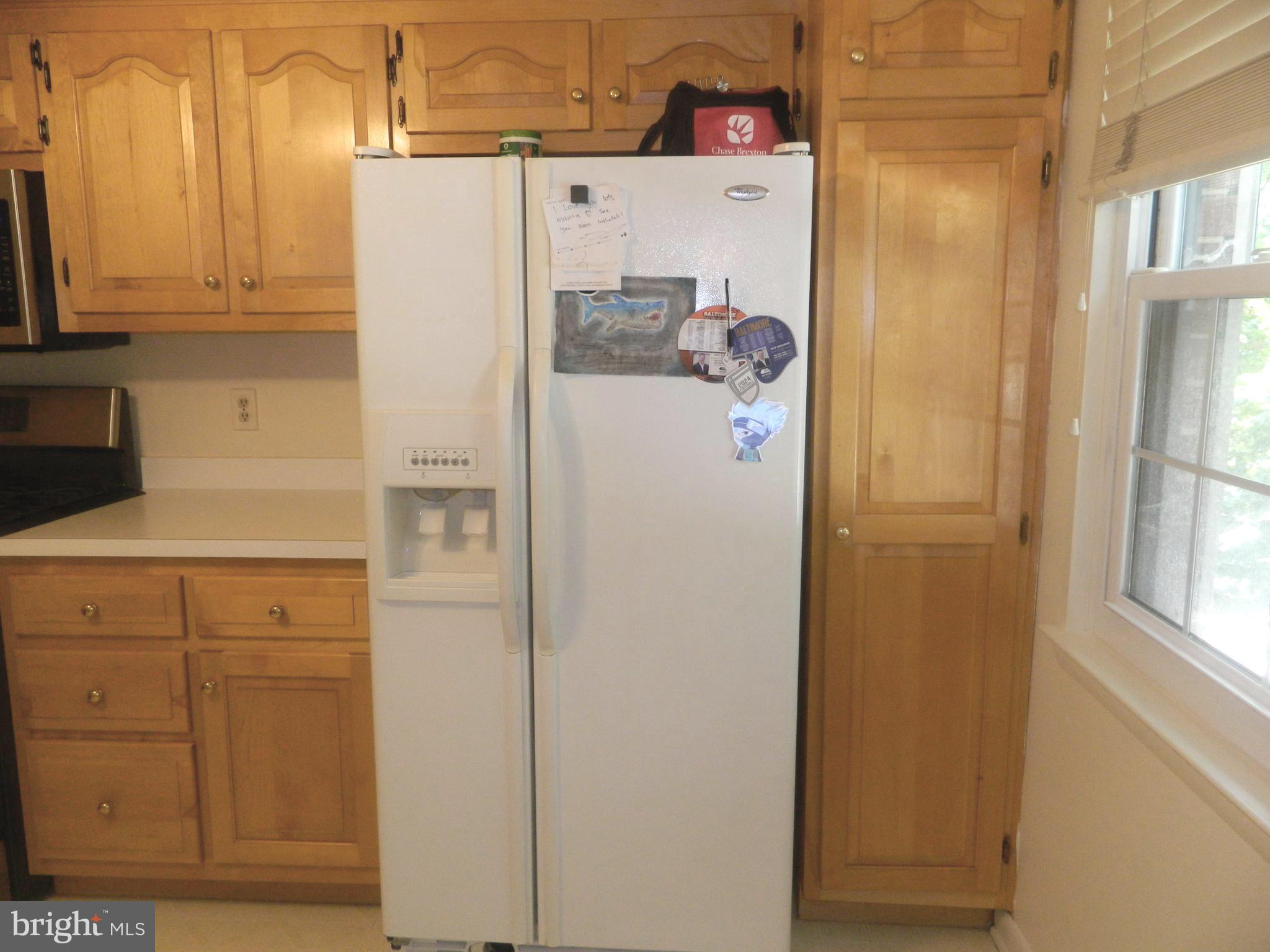 17 Theo Lane, Unit 17 Towson, MD 21204 - Photo 13 of 54 a white refrigerator freezer sitting in a kitchen