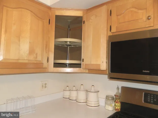 a stove top oven sitting inside of a kitchen