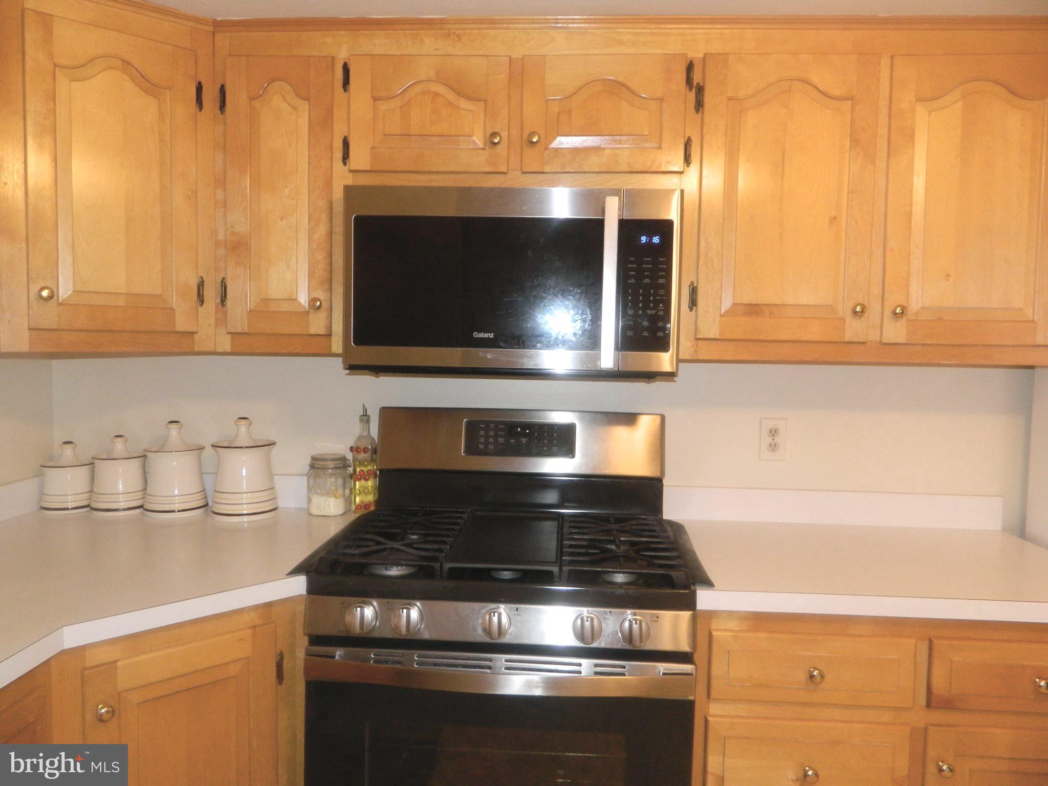 17 Theo Lane, Unit 17 Towson, MD 21204 - Photo 17 of 54 a stove top oven sitting inside of a kitchen