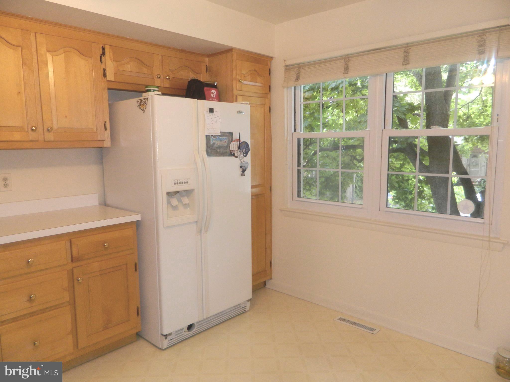 17 Theo Lane, Unit 17 Towson, MD 21204 - Photo 18 of 54 a white refrigerator freezer sitting in a kitchen