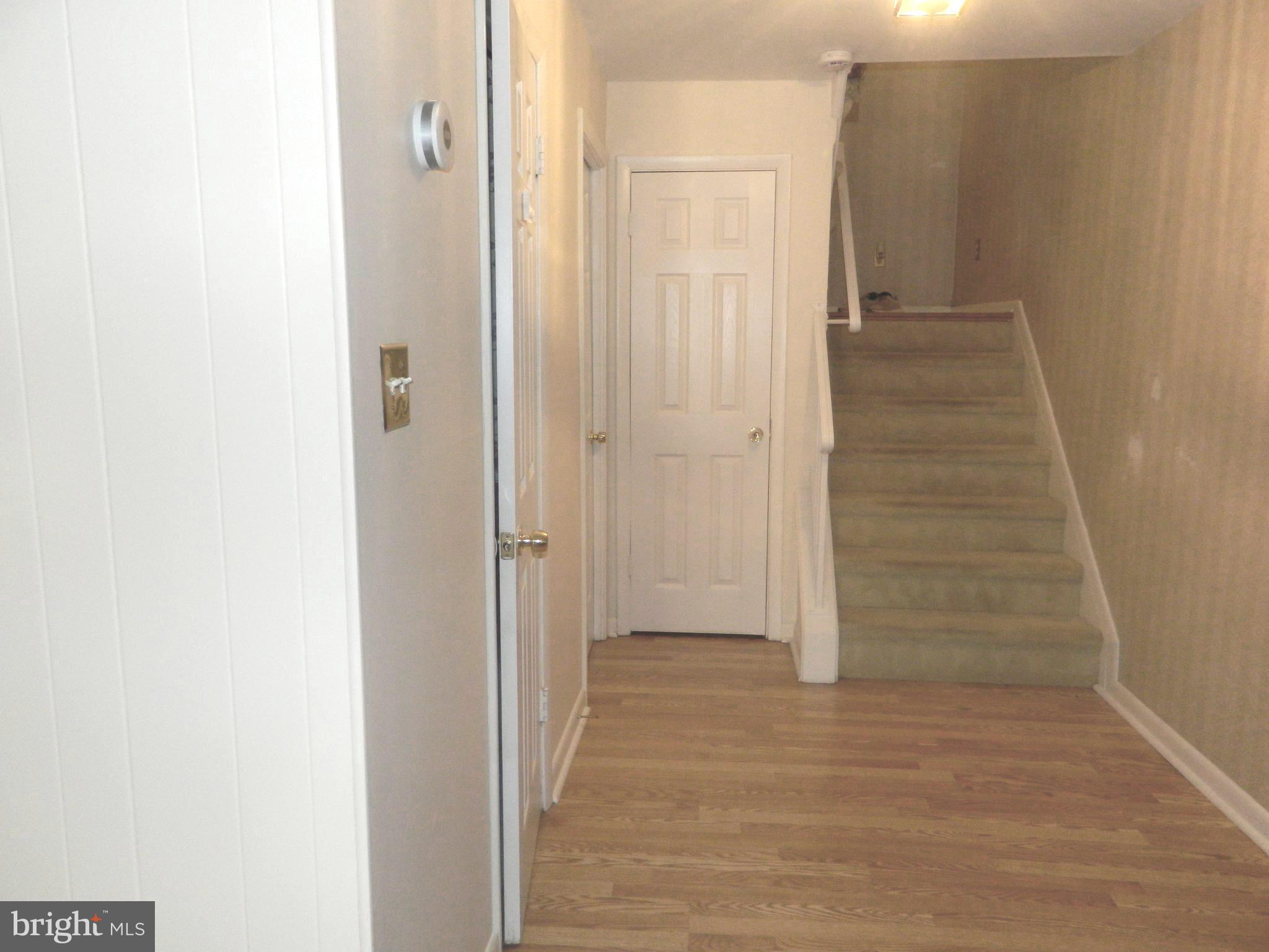 17 Theo Lane, Unit 17 Towson, MD 21204 - Photo 21 of 54 a view of a hallway with wooden floor