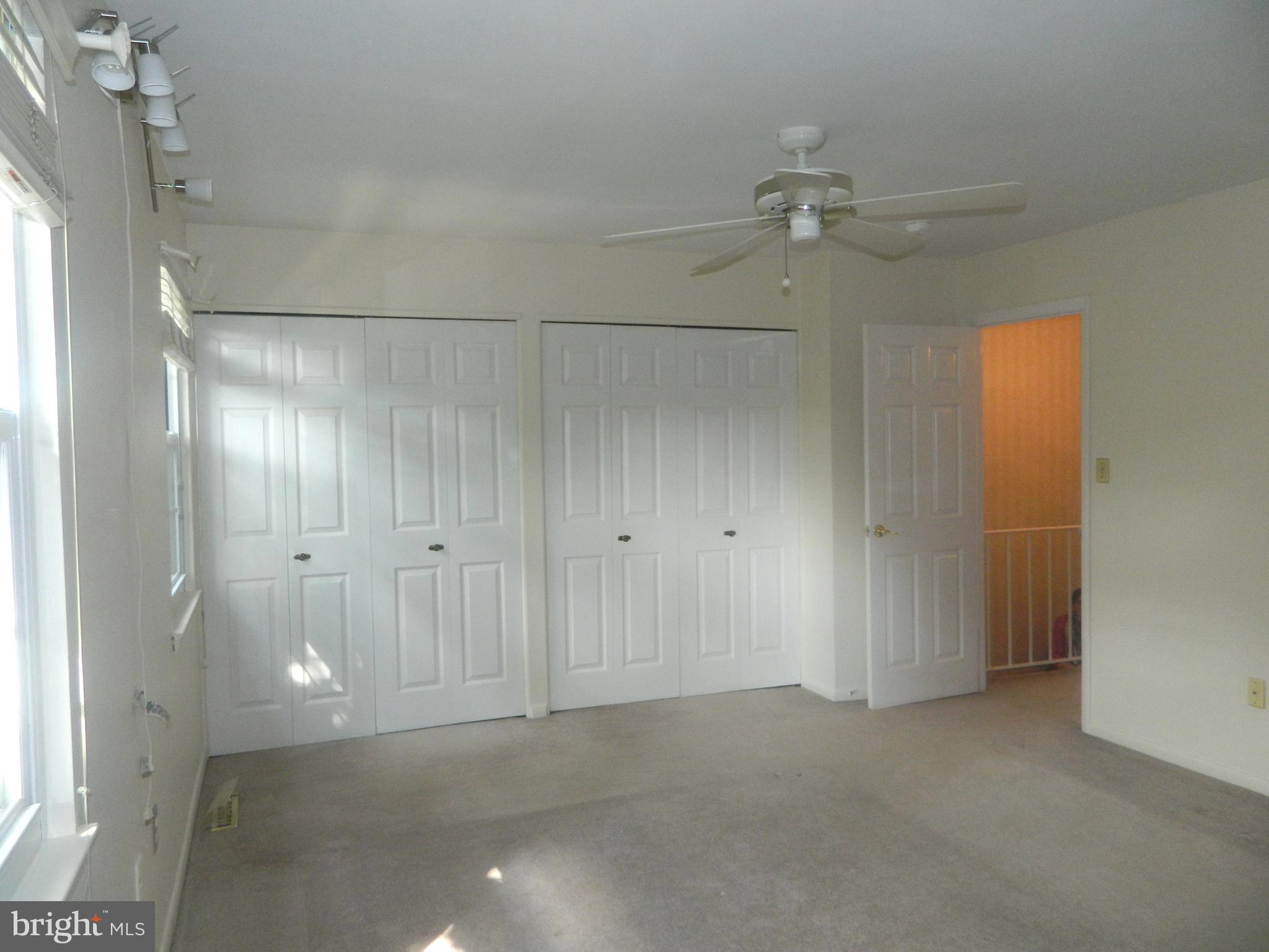 17 Theo Lane, Unit 17 Towson, MD 21204 - Photo 27 of 54 an empty room with closet and a window