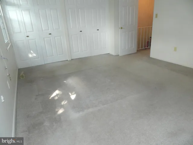 a bathroom with a toilet and a vanity
