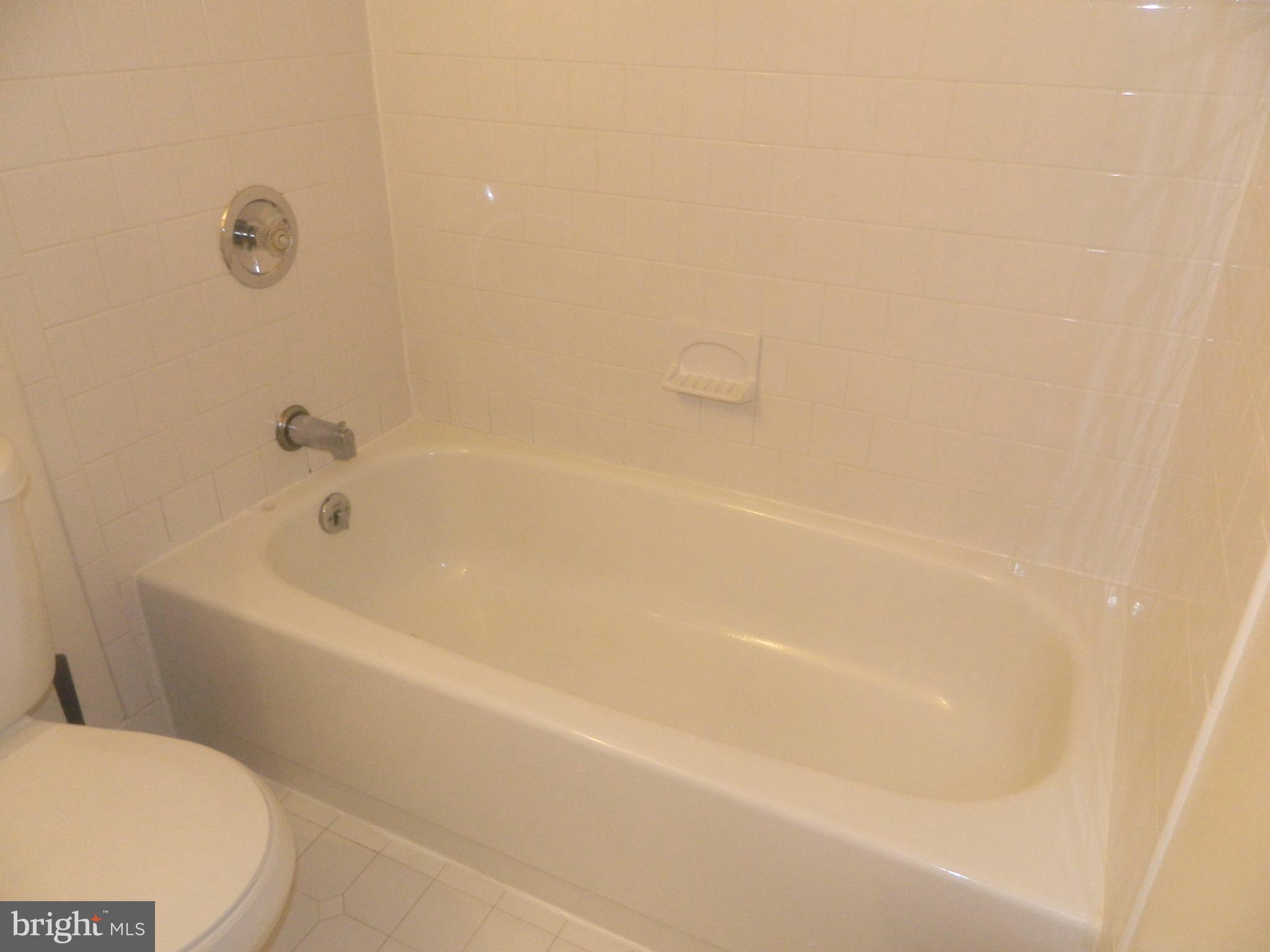 17 Theo Lane, Unit 17 Towson, MD 21204 - Photo 35 of 54 a bathroom with a bathtub