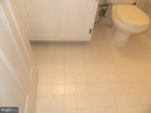 a view of kitchen with cabinets and wooden floor