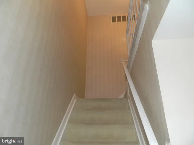 a balcony with table and chairs