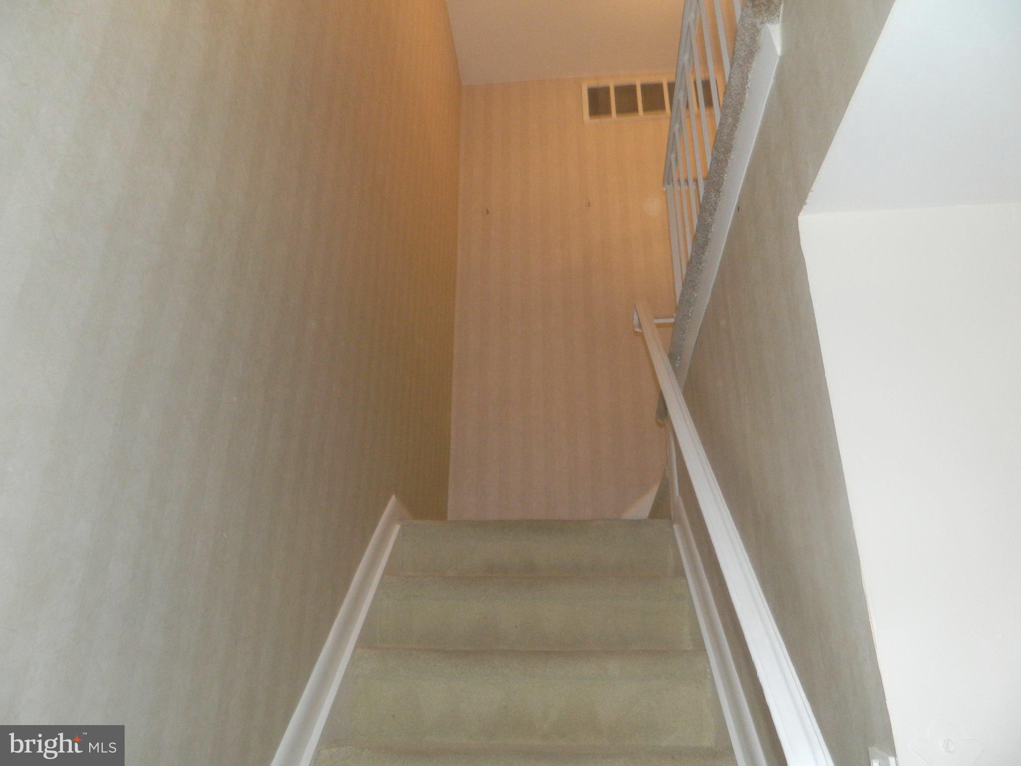17 Theo Lane, Unit 17 Towson, MD 21204 - Photo 42 of 54 a view of staircase with white walls